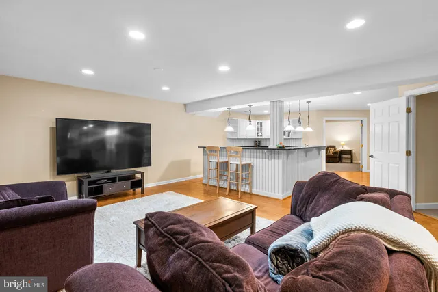 a kitchen with granite countertop a sink a counter space appliances and cabinets