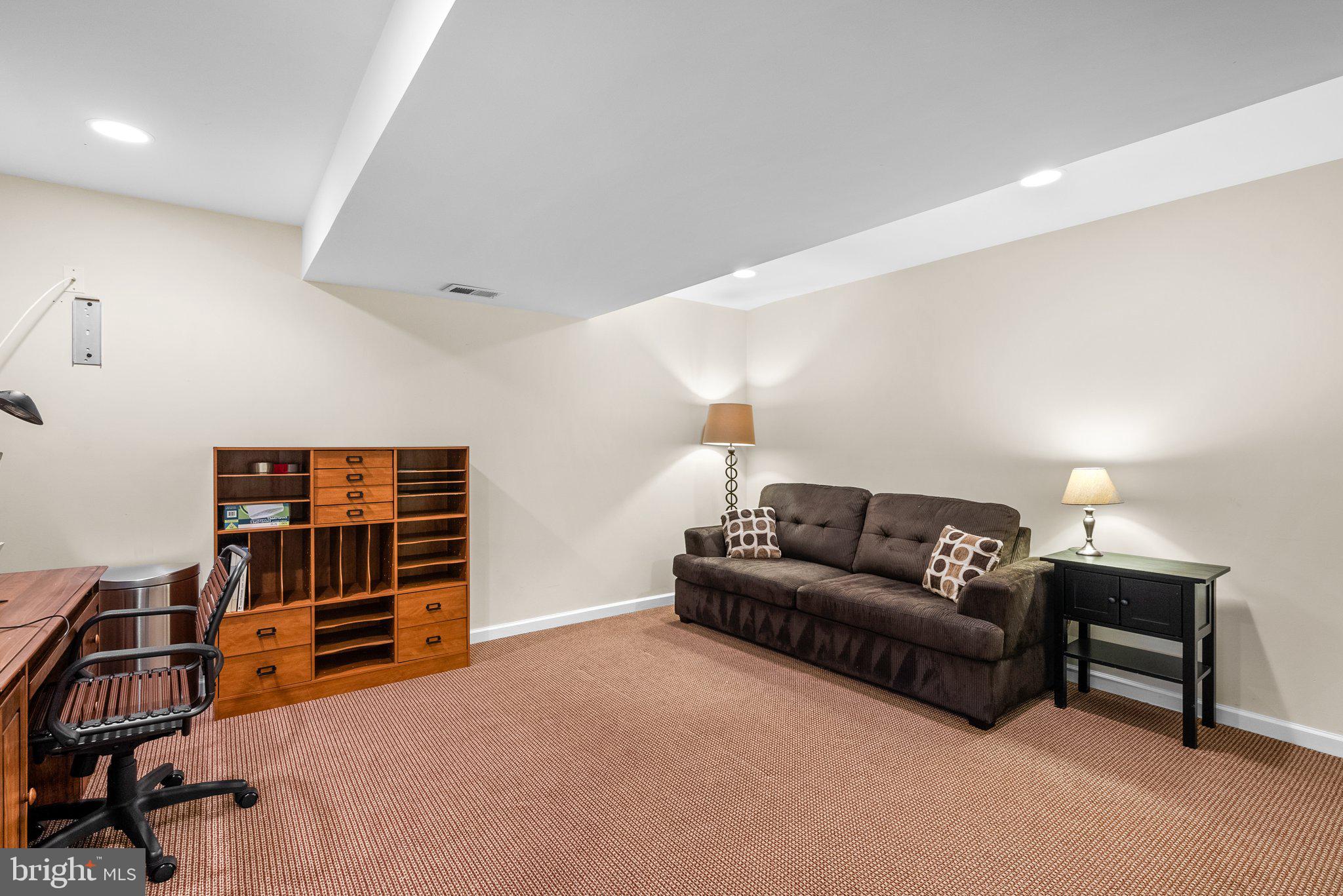869 Still Creek Lane Gaithersburg, MD 20878 - Photo 44 of 58 a living room with furniture and a flat screen tv