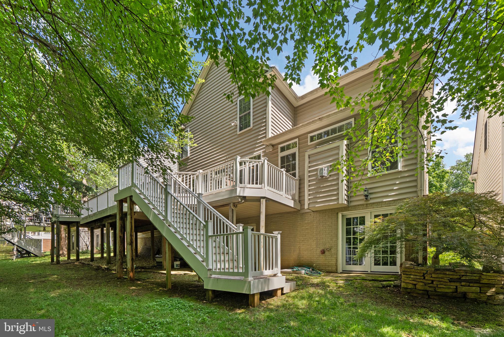 869 Still Creek Lane Gaithersburg, MD 20878 - Photo 50 of 58 a view of a house with a yard