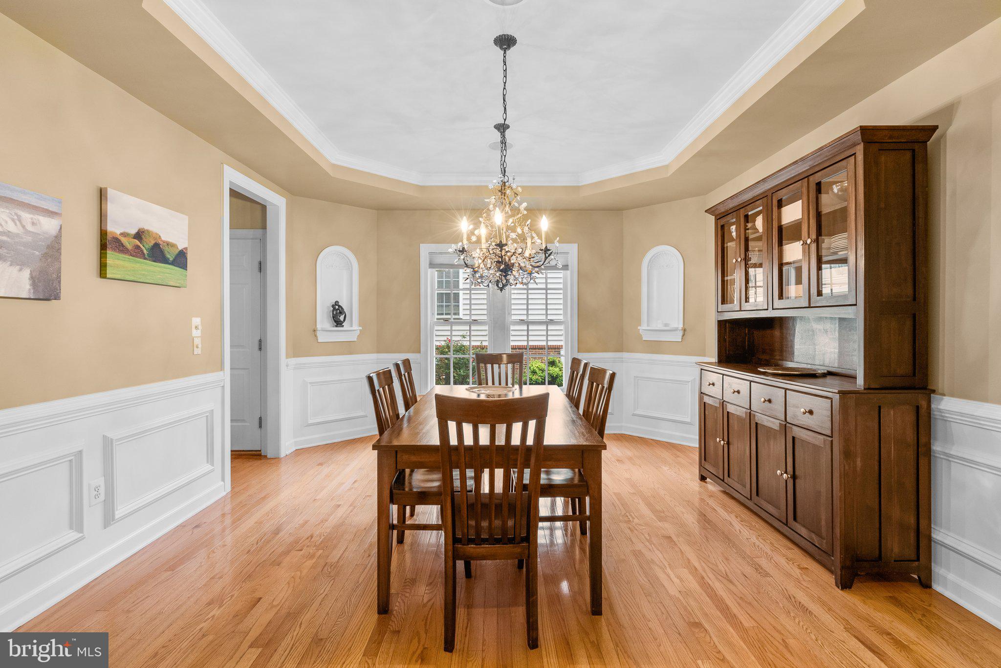 869 Still Creek Lane Gaithersburg, MD 20878 - Photo 5 of 58 a view of a dining room with furniture window and wooden floor