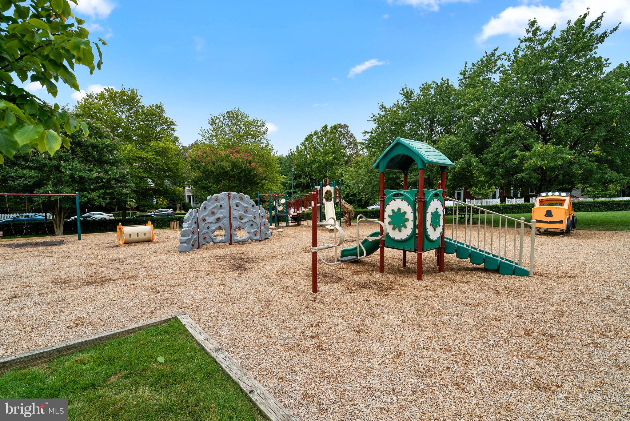 869 Still Creek Lane Gaithersburg, MD 20878 - Photo 52 of 58 a backyard of a house with table and chairs