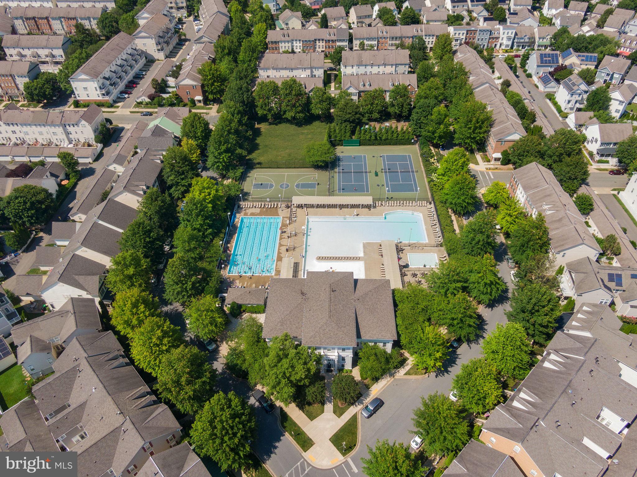 869 Still Creek Lane Gaithersburg, MD 20878 - Photo 56 of 58 an aerial view of multiple houses with yard