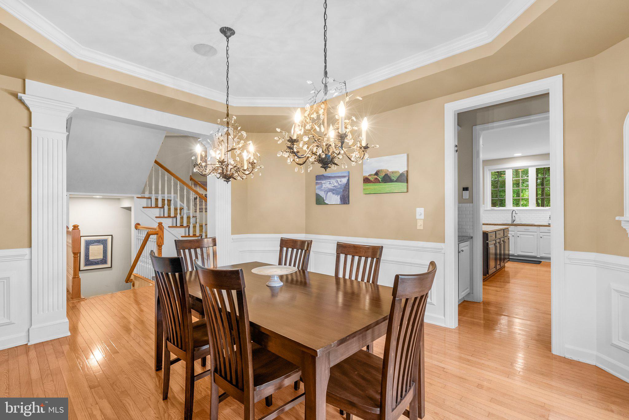 869 Still Creek Lane Gaithersburg, MD 20878 - Photo 6 of 58 a view of a dining room with furniture wooden floor and chandelier