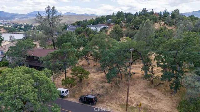 an aerial view of a houses with a street
