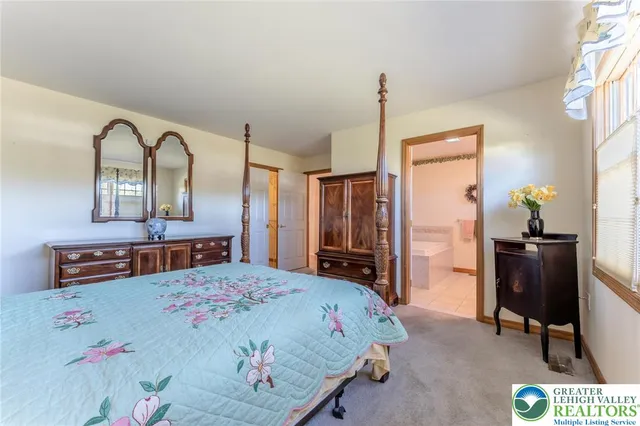 a bath tub sitting next to a white sink