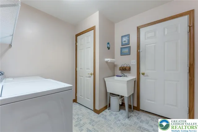 a picture of a bathroom with a shower