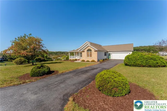 a view of a two chairs in the balcony