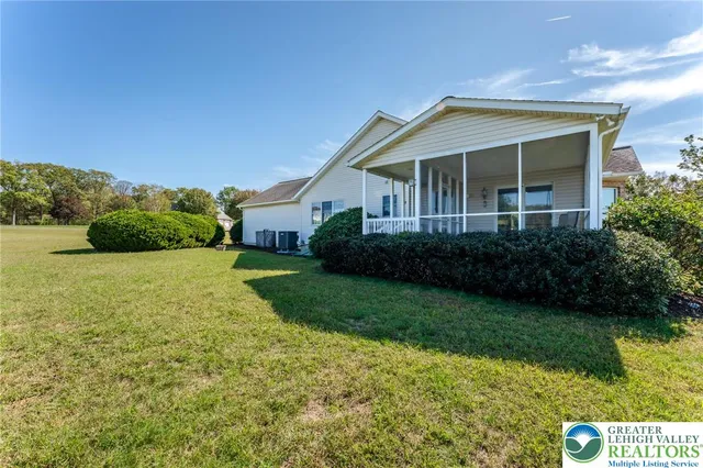 a view of a brick house with a large window