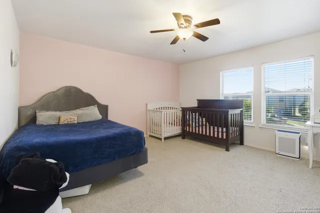 a room with stairs and a book shelf