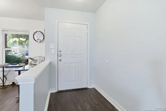 a view of room with window and hardwood floor