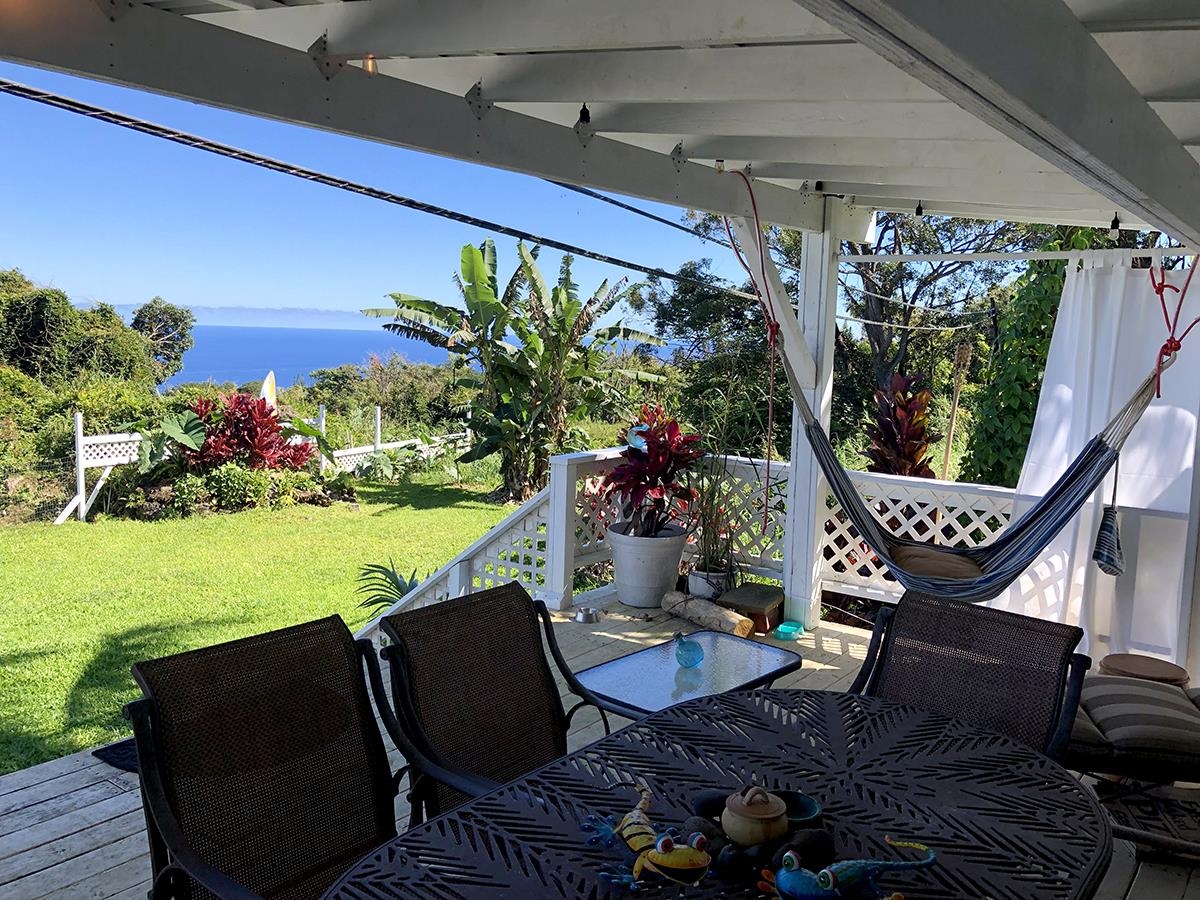 979 Hana Highway Haiku, HI 96708 - Photo 20 of 25 a view of a chairs and table in patio with potted plants