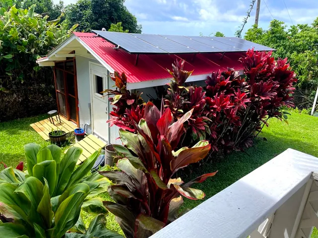 a view of a house with a flower garden