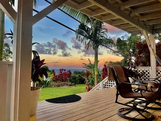 a view of outdoor space with wooden floor and seating space