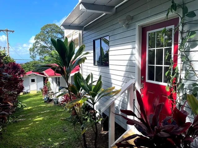 a view of a house with a backyard