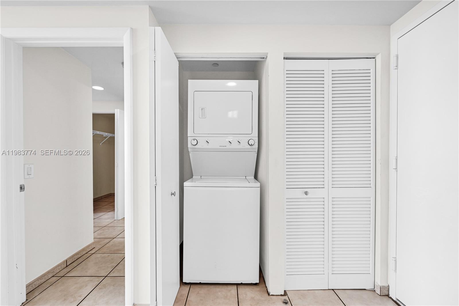 2475 Brickell Avenue, Unit 703 Miami, FL 33129 - Photo 21 of 30 a view of bathroom with a washer and dryer