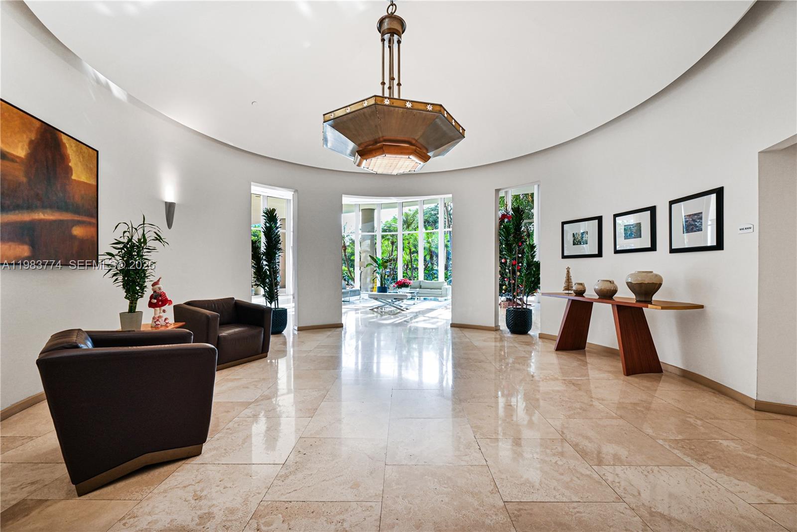 2475 Brickell Avenue, Unit 703 Miami, FL 33129 - Photo 24 of 30 a living room with furniture and a flat screen tv