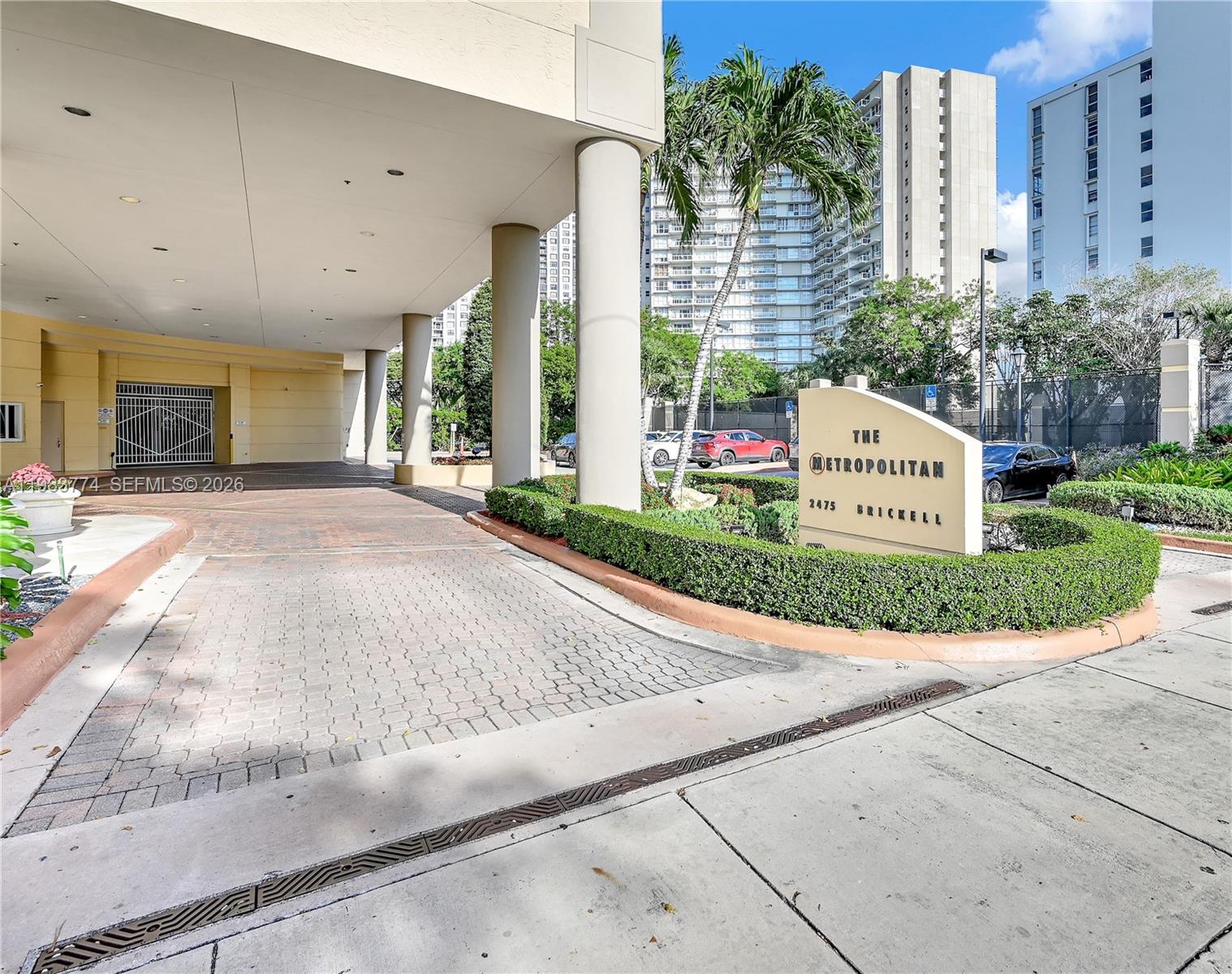 2475 Brickell Avenue, Unit 703 Miami, FL 33129 - Photo 30 of 30 a front view of a building with a garden and plants