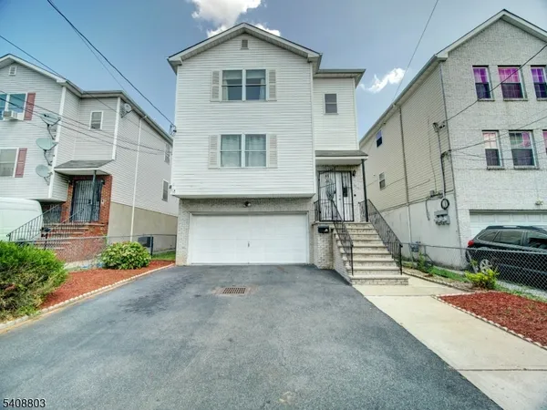 a view of a house with a street