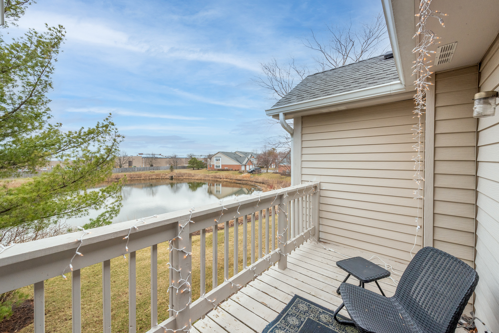 2458 Charleston Drive, Unit 6 Schaumburg, IL 60193 - Photo 13 of 31 a view of a balcony with chair and wooden floor