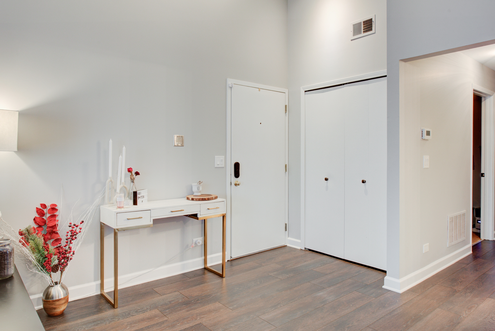2458 Charleston Drive, Unit 6 Schaumburg, IL 60193 - Photo 5 of 31 a view of a hallway with workspace and wooden floor