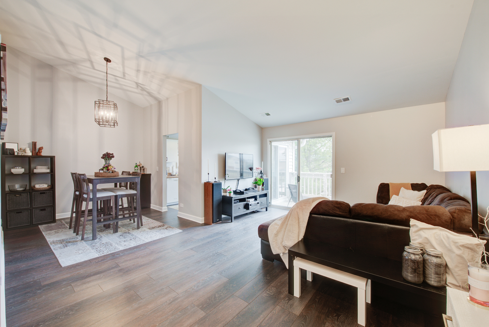 2458 Charleston Drive, Unit 6 Schaumburg, IL 60193 - Photo 7 of 31 a living room with furniture a dining table and a wooden floor