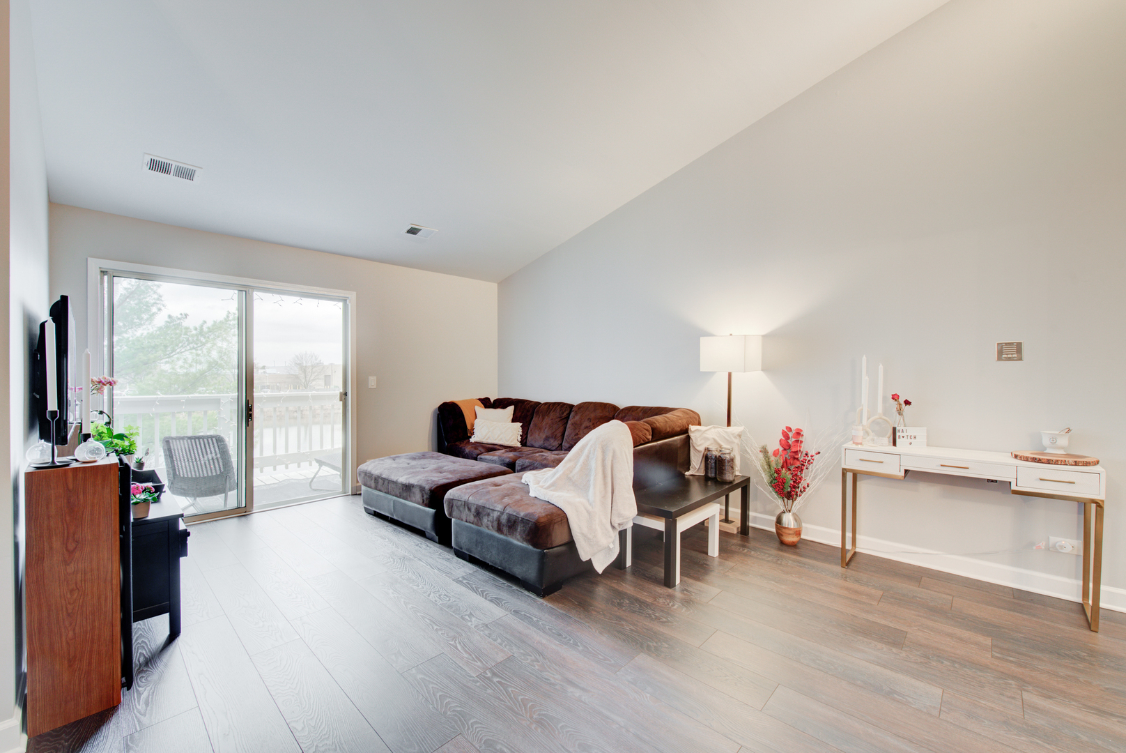 2458 Charleston Drive, Unit 6 Schaumburg, IL 60193 - Photo 9 of 31 a living room with furniture and floor to ceiling window