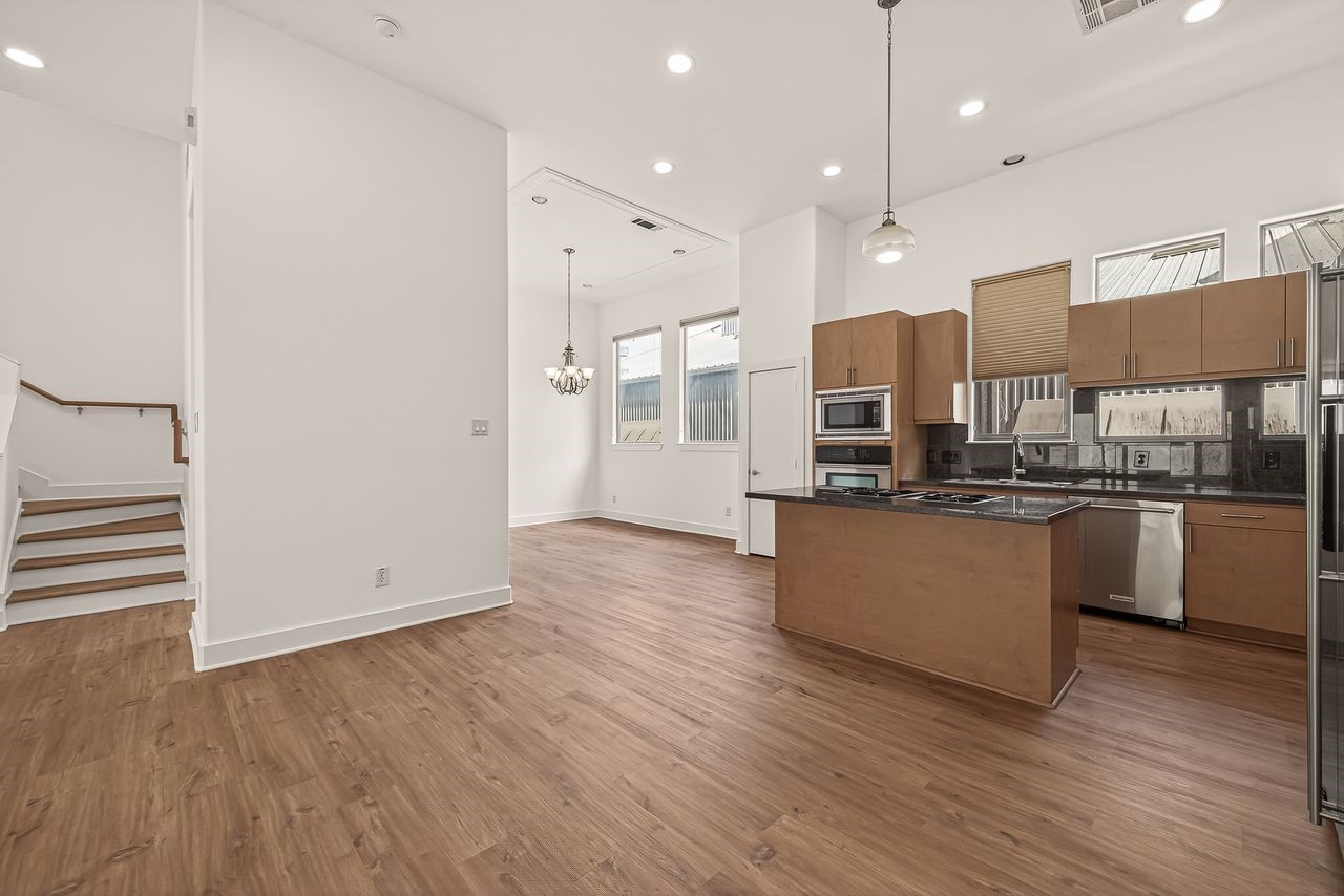 724 Ruthven Street Houston, TX 77019 - Photo 8 of 44 This sleek and modern kitchen features stainless steel appliances, beautiful cabinets and granite counters
