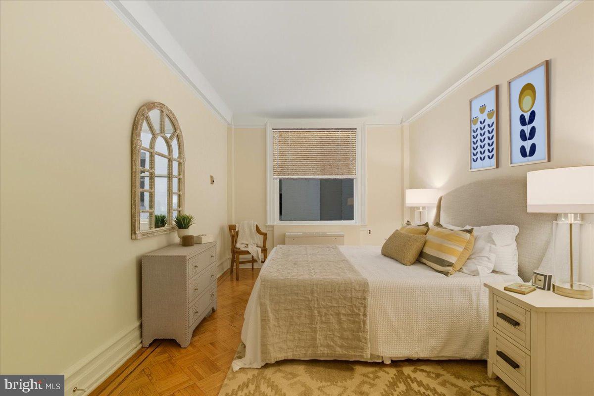 2126 Connecticut Avenue Northwest, Unit 28 Washington, DC 20008 - Photo 23 of 34 a bedroom with a bed and wooden floor