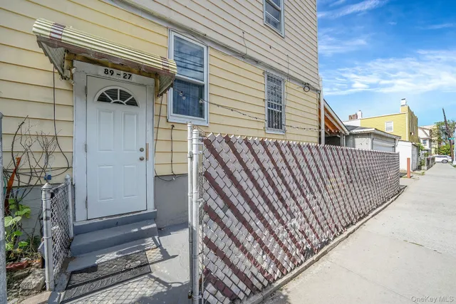a view of a porch with wooden floor and stairs