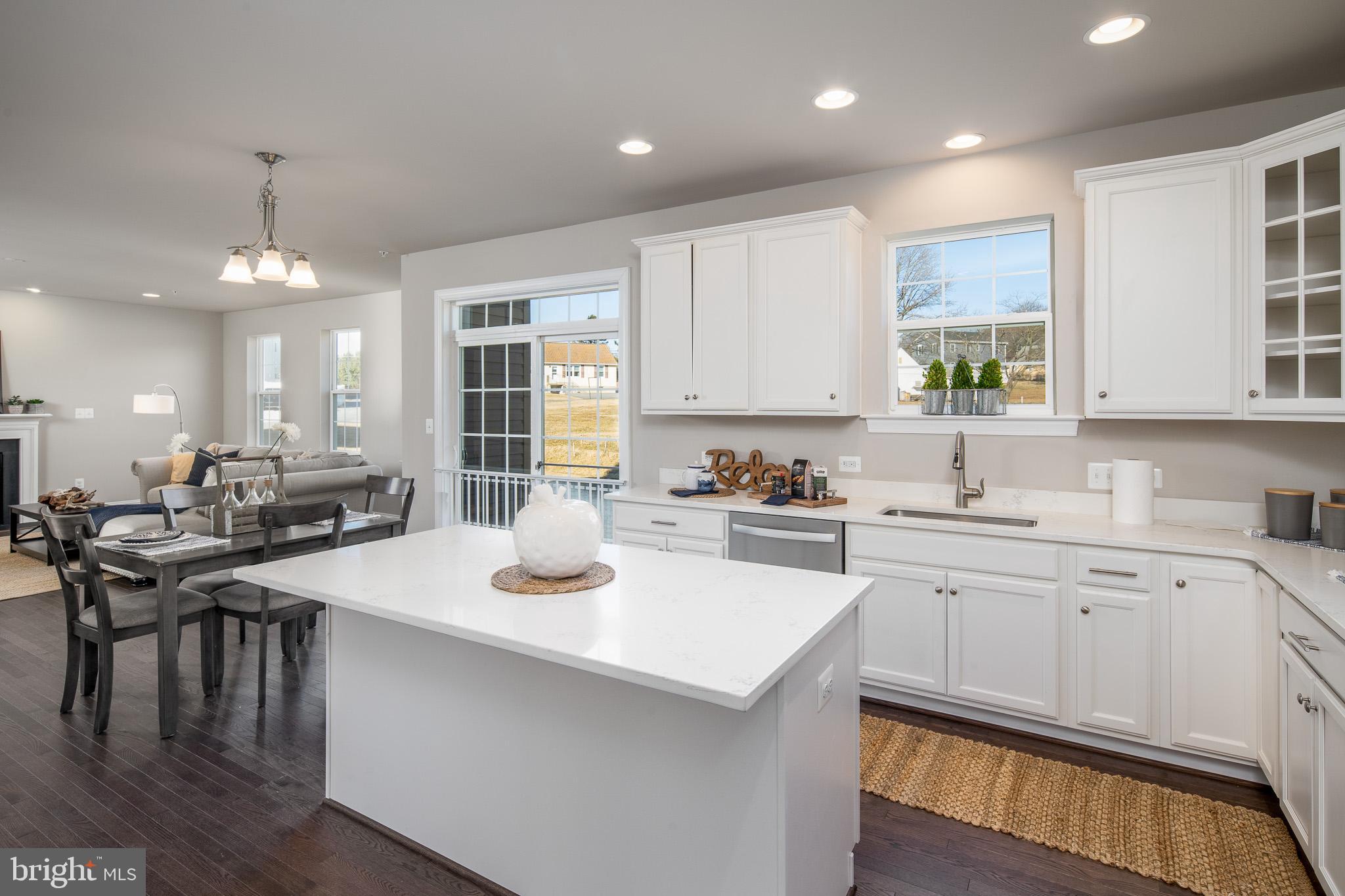 6444 Hanover Road Hanover, MD 21076 - Photo 20 of 29 a kitchen with a sink stove and cabinets