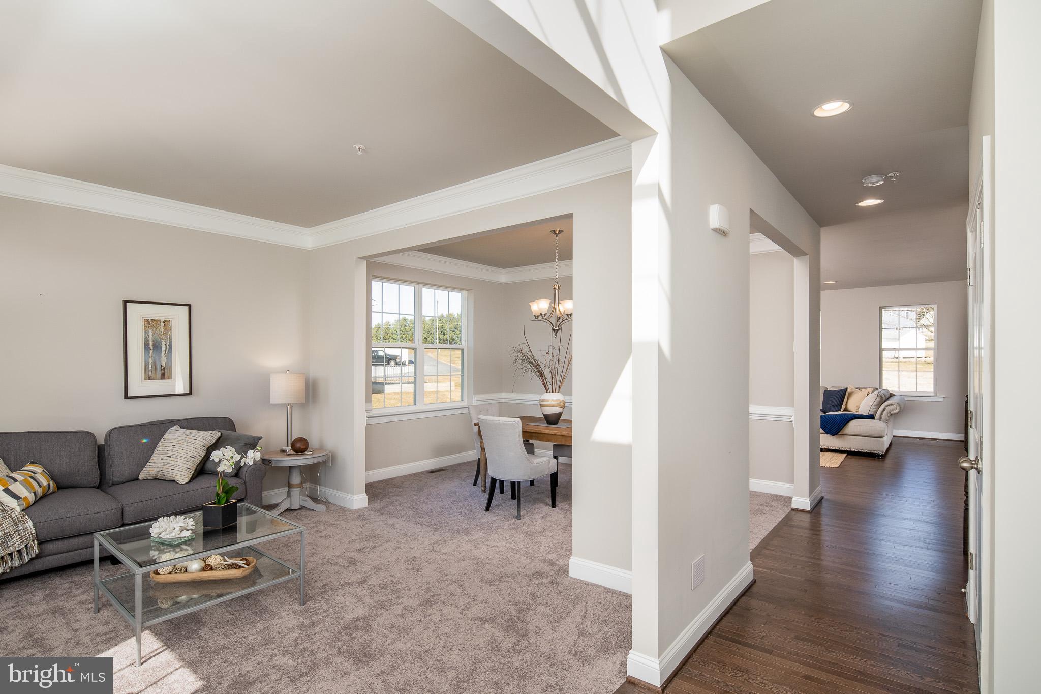 6444 Hanover Road Hanover, MD 21076 - Photo 28 of 29 a living room with furniture and a wooden floor