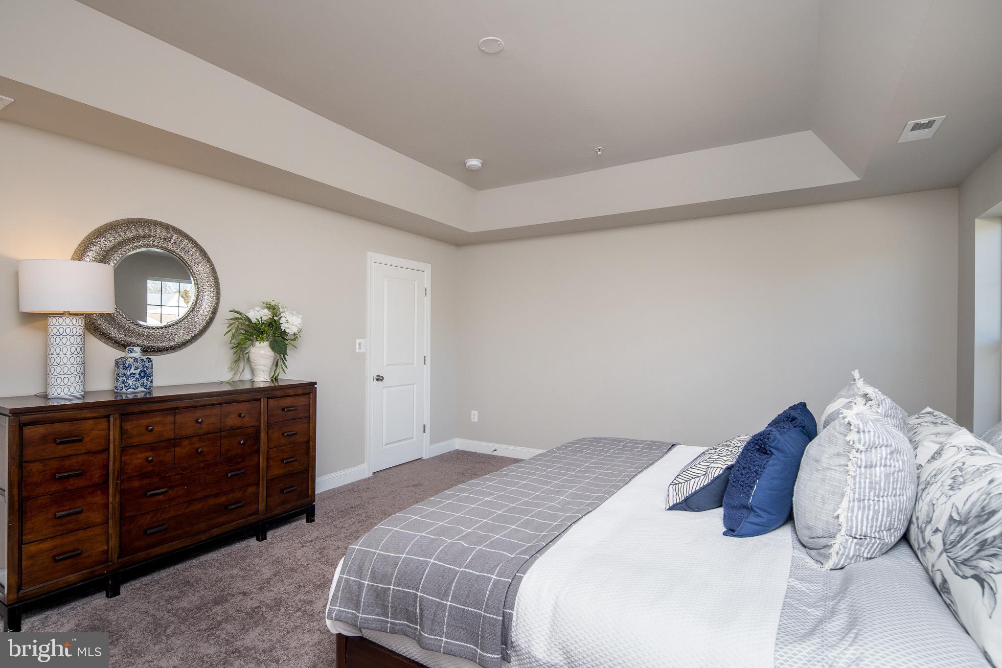 6444 Hanover Road Hanover, MD 21076 - Photo 7 of 29 a bedroom with a bed and a dresser