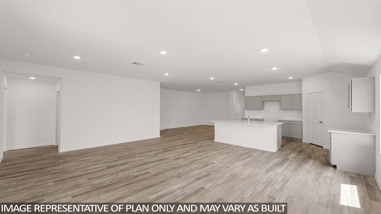 16819 Country Roots Avenue Conroe, TX 77302 - Photo 6 of 30 a view of kitchen with kitchen island refrigerator sink and wooden floor