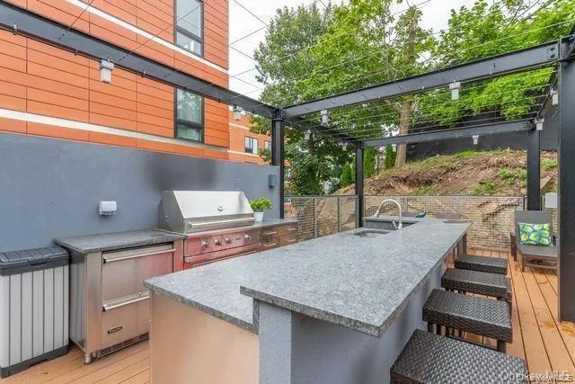 a roof deck with a table and chairs
