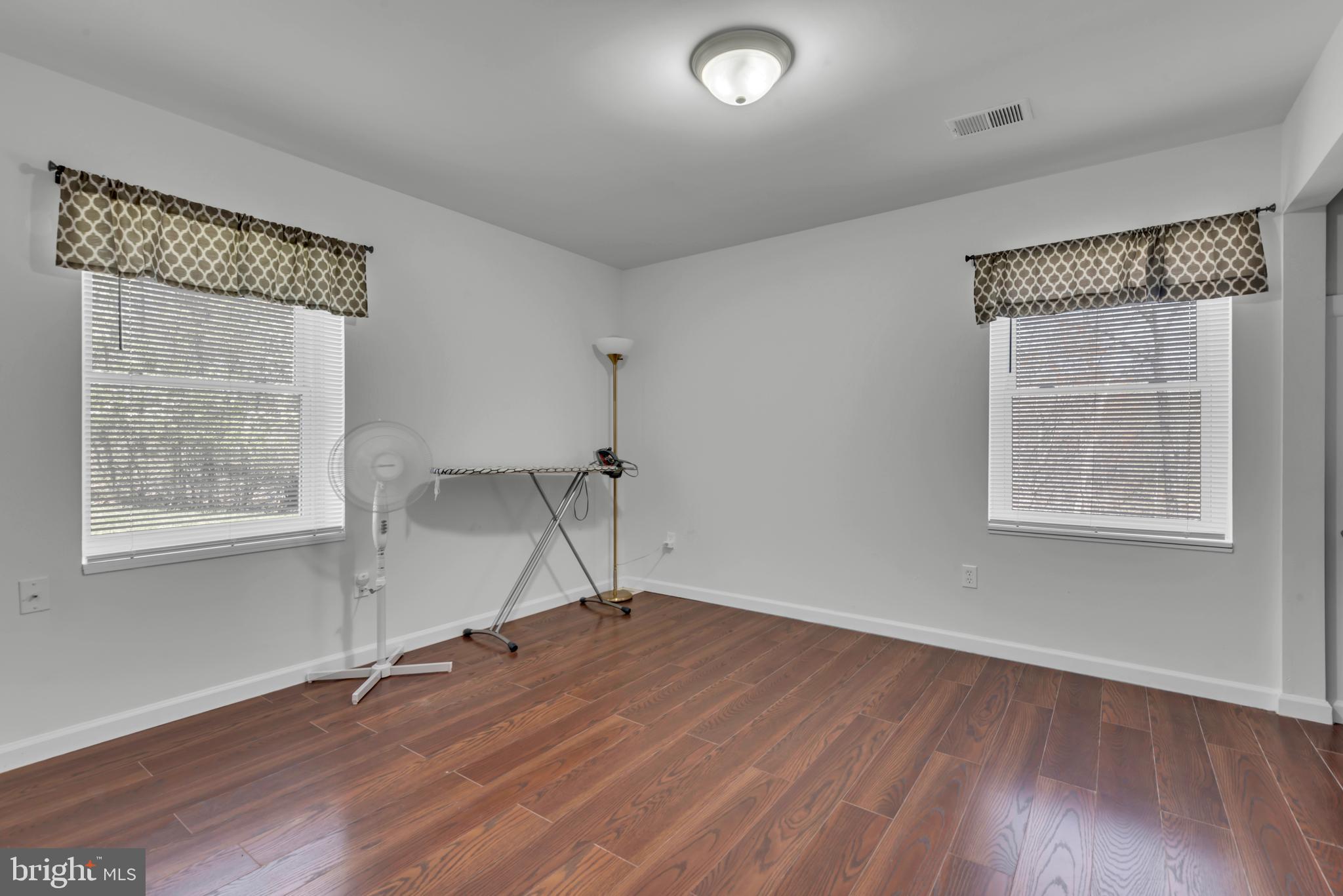 2012 Frontier Court Fort Washington, MD 20744 - Photo 29 of 42 a view of an empty room with wooden floor and a window