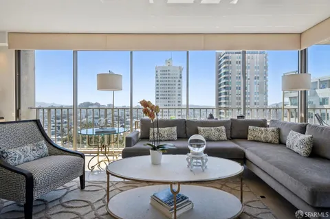 a living room with furniture and a table