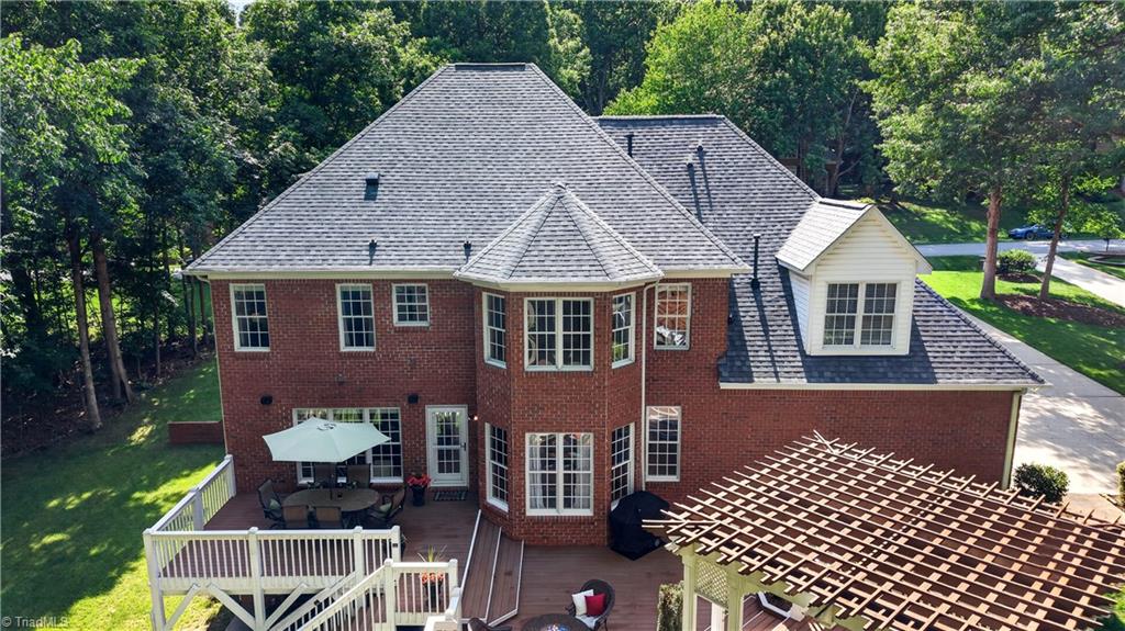 8508 Rosedale Drive Oak Ridge, NC 27310 - Photo 47 of 50 See it all—deck, patio, and privacy for days.