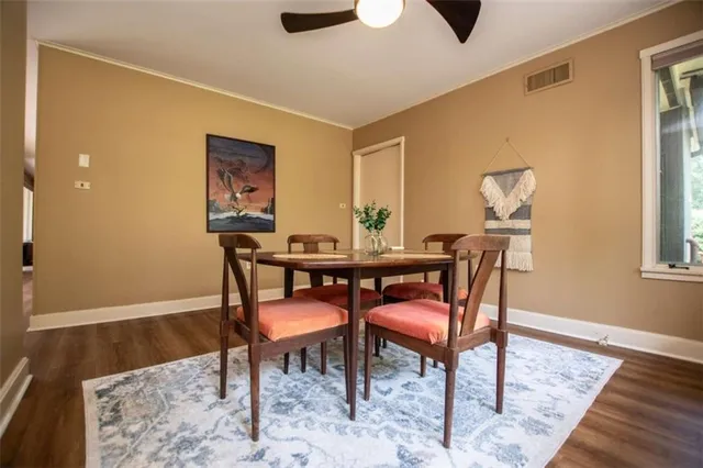 a dining room with furniture and window