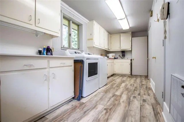 a kitchen with a stove a sink and a refrigerator