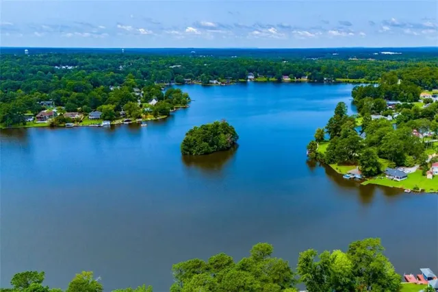 an aerial view of a house with a lake view