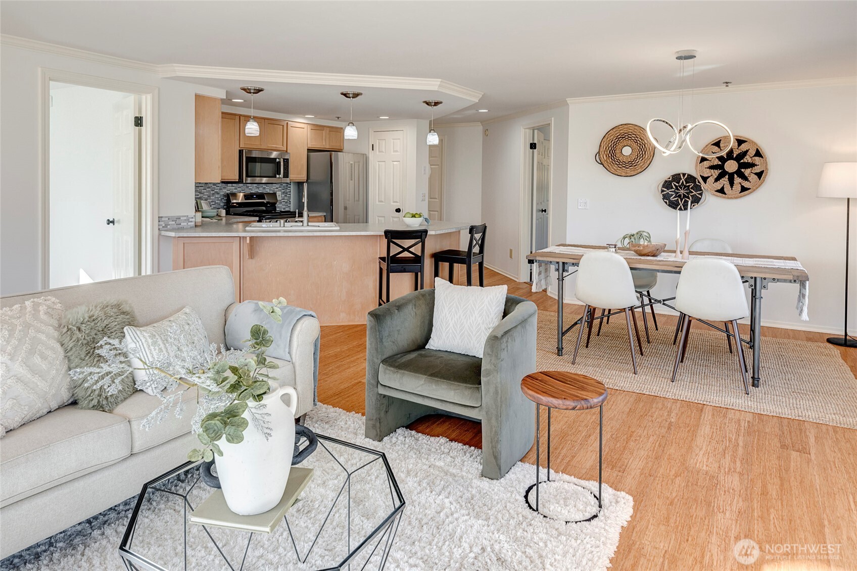 3621 Wallingford Avenue North, Unit 201 Seattle, WA 98103 - Photo 12 of 27 a living room with furniture kitchen view and a wooden floor