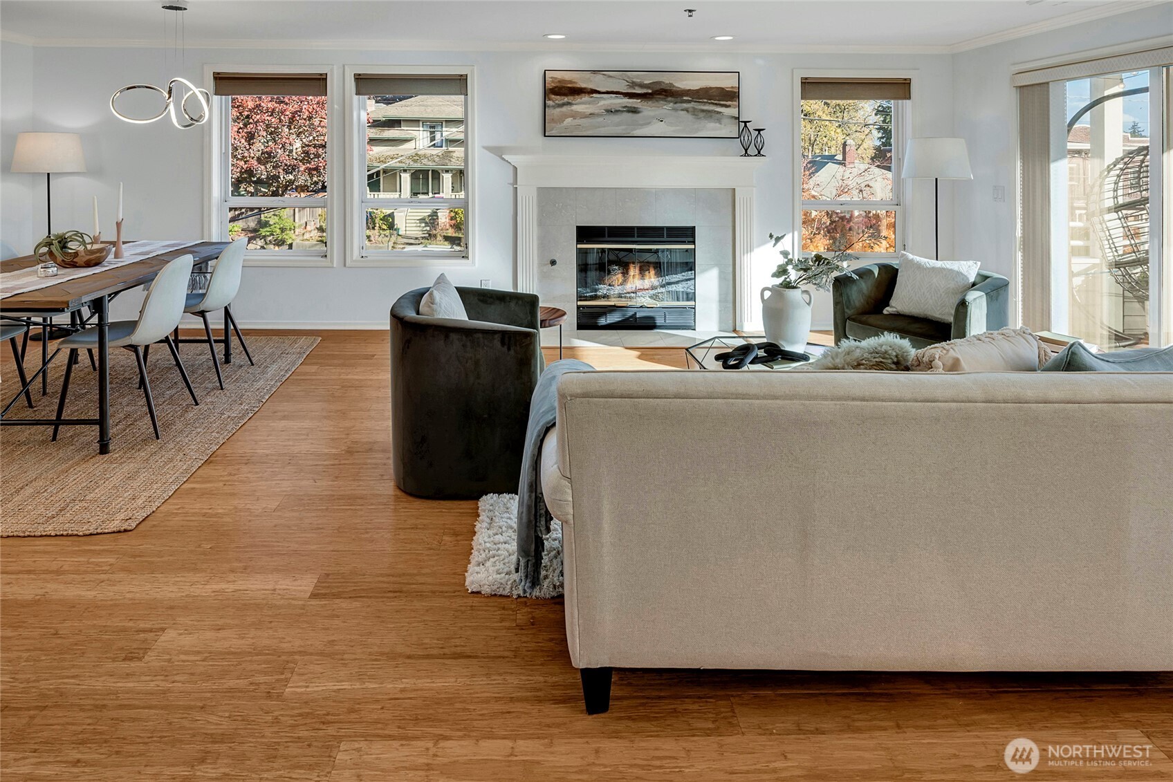 3621 Wallingford Avenue North, Unit 201 Seattle, WA 98103 - Photo 14 of 27 a living room with furniture a fireplace and a large window