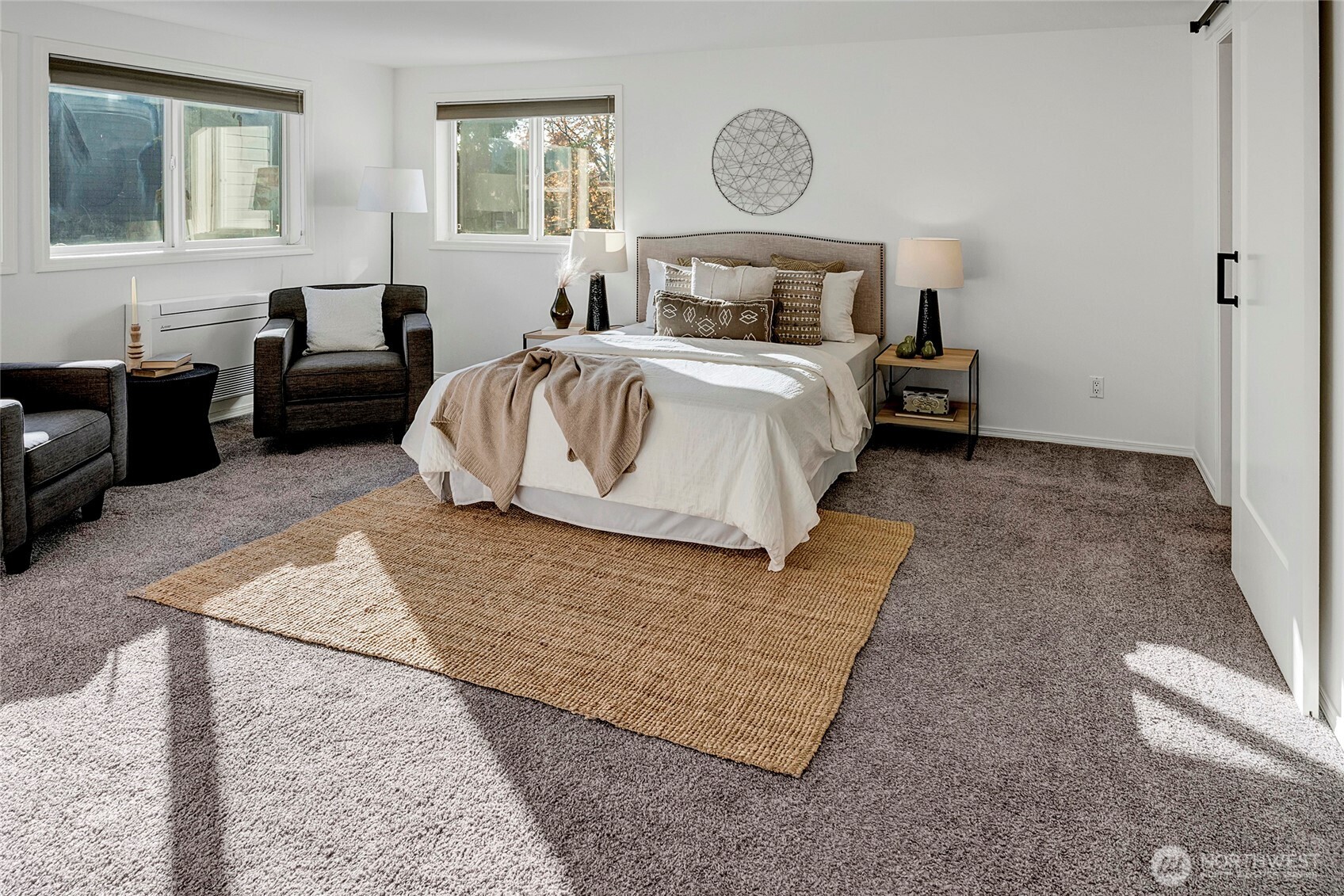 3621 Wallingford Avenue North, Unit 201 Seattle, WA 98103 - Photo 15 of 27 a bedroom with a bed lamp on desk and a window