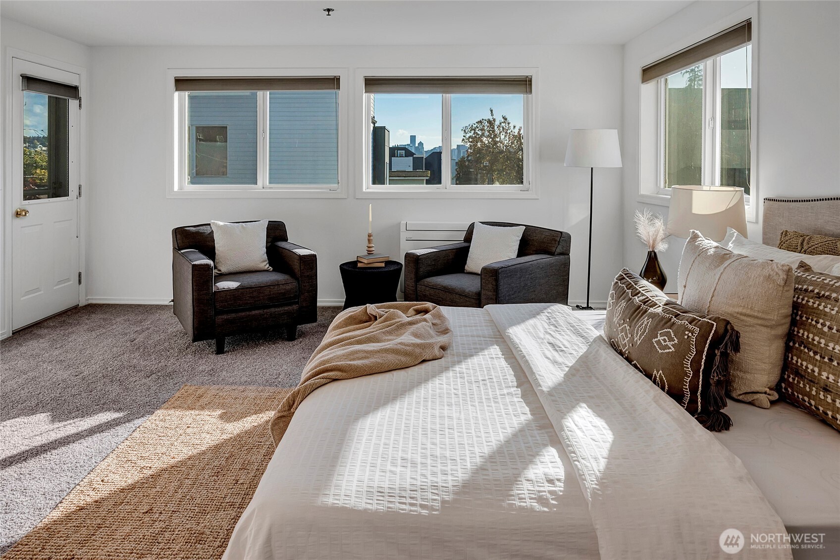 3621 Wallingford Avenue North, Unit 201 Seattle, WA 98103 - Photo 16 of 27 a bedroom with bed couch and window
