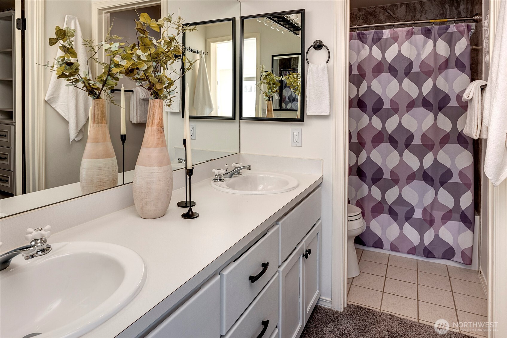 3621 Wallingford Avenue North, Unit 201 Seattle, WA 98103 - Photo 18 of 27 a bathroom with a sink and a mirror