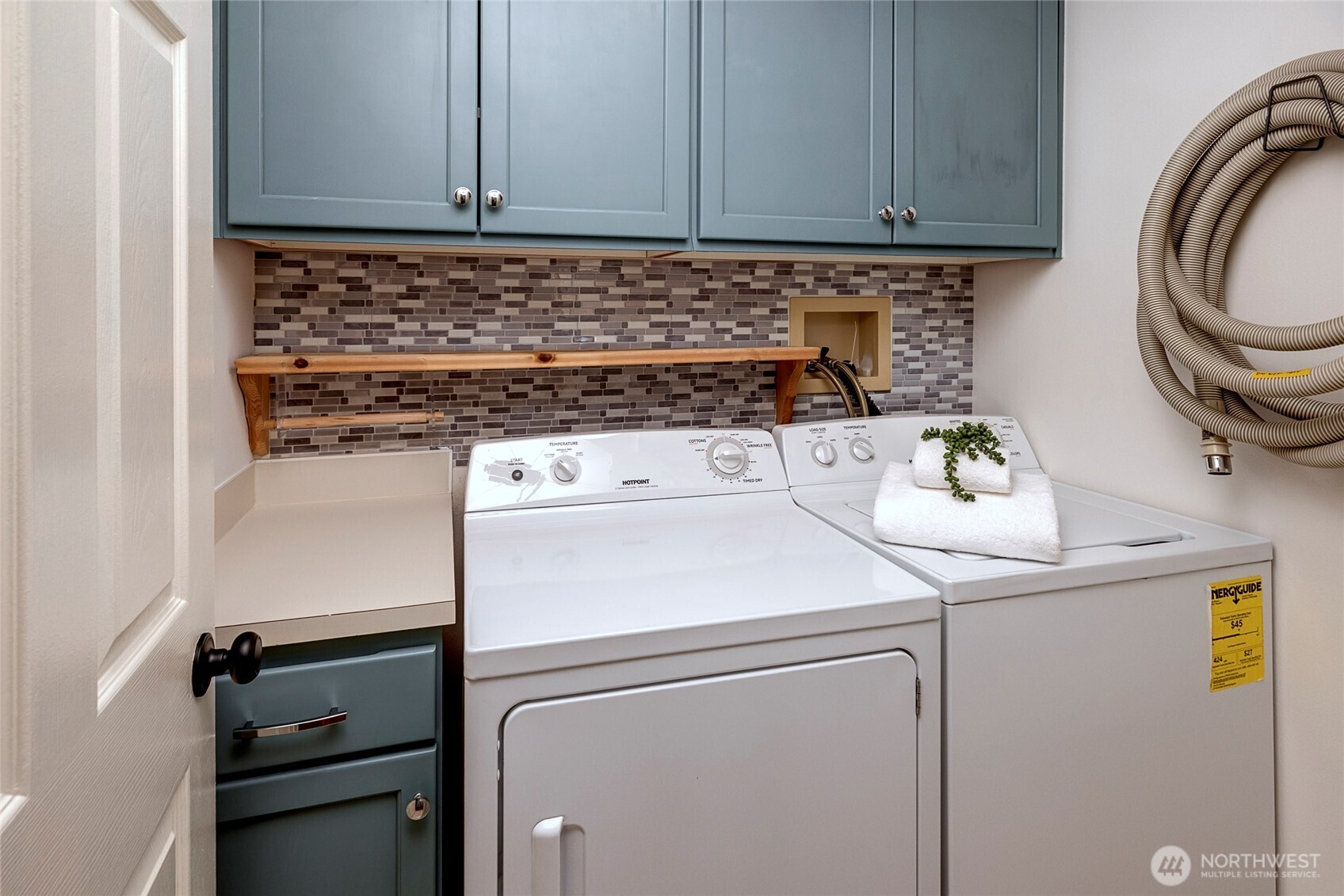 3621 Wallingford Avenue North, Unit 201 Seattle, WA 98103 - Photo 22 of 27 a close view of washer and dryer