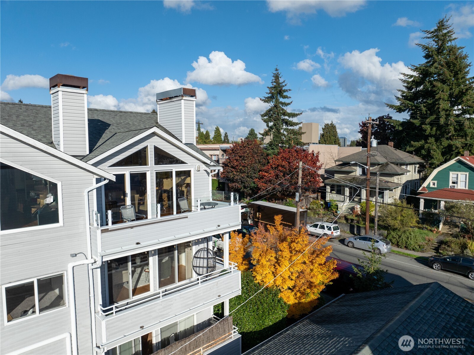 3621 Wallingford Avenue North, Unit 201 Seattle, WA 98103 - Photo 26 of 27 a front view of a residential apartment building with a yard