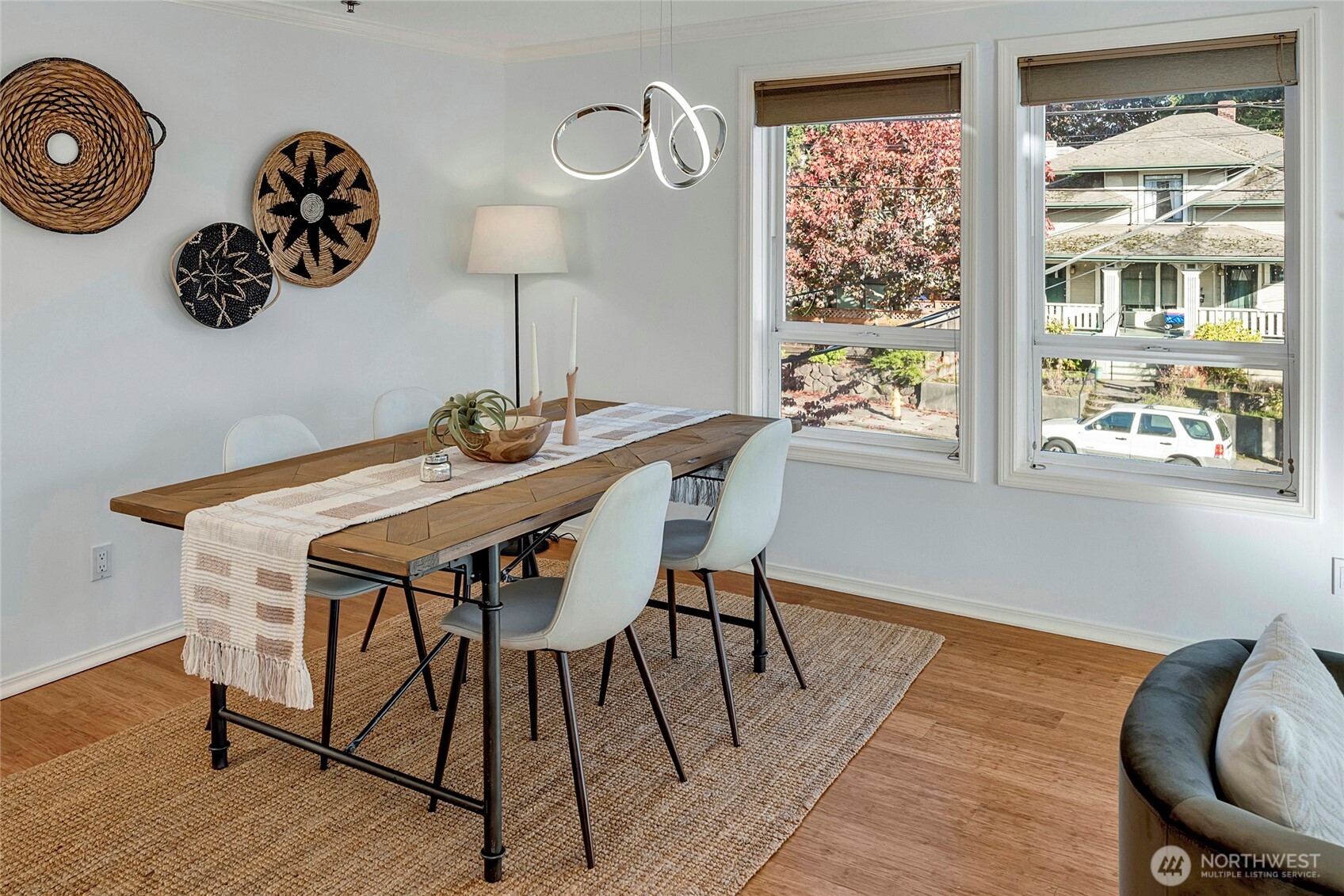 3621 Wallingford Avenue North, Unit 201 Seattle, WA 98103 - Photo 6 of 27 a view of a dining room with furniture window and wooden floor