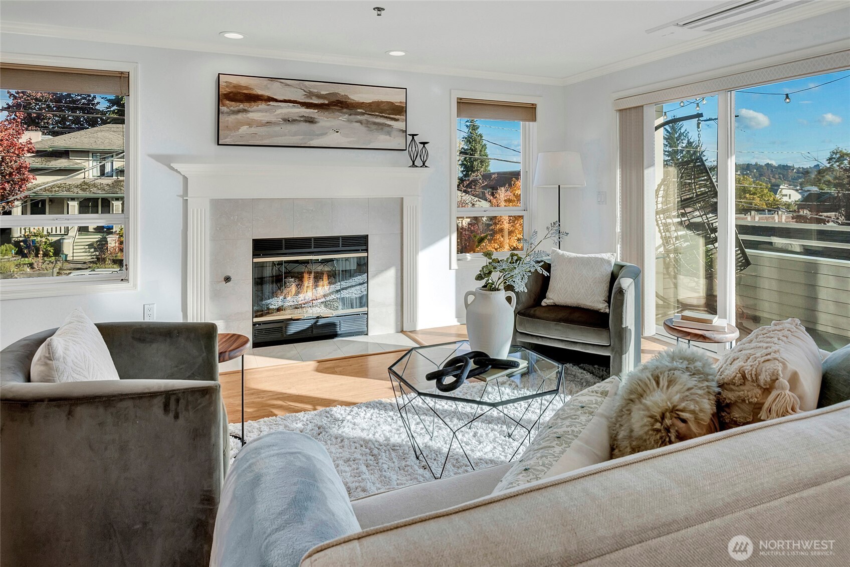 3621 Wallingford Avenue North, Unit 201 Seattle, WA 98103 - Photo 8 of 27 a living room with furniture and a fireplace