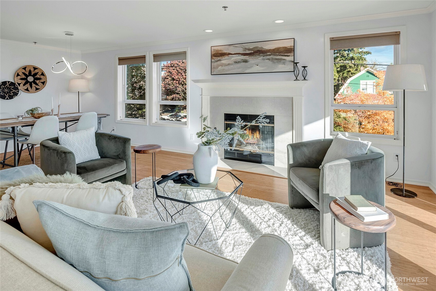 3621 Wallingford Avenue North, Unit 201 Seattle, WA 98103 - Photo 10 of 27 a living room with furniture and a fireplace